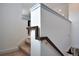 Carpeted staircase with wooden handrail, connecting different levels of the home at 113 Kenny Blvd, Haines City, FL 33844