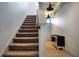 Carpeted staircase with unique Harry Potter inspired decor at 113 Kenny Blvd, Haines City, FL 33844