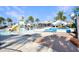 Community splash park featuring a fun water playground with slides, a pool, and shady seating areas at 113 Kenny Blvd, Haines City, FL 33844