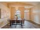 Dining room features high ceilings, hardwood floors, a modern chandelier, and natural light from large windows at 1145 Sugar Belt Dr, St Cloud, FL 34771