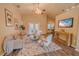 Cozy living room featuring hardwood floors, comfortable seating, natural light, and stylish decor at 1145 Sugar Belt Dr, St Cloud, FL 34771