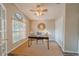 Bright home office with a large window, hard wood floors, and a ceiling fan at 1145 Sugar Belt Dr, St Cloud, FL 34771