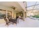 A spacious, screened patio with a pool and a dining area, perfect for relaxation and outdoor entertainment at 1145 Sugar Belt Dr, St Cloud, FL 34771