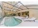Screened in pool area featuring a in-ground pool with lounge chairs at 1145 Sugar Belt Dr, St Cloud, FL 34771