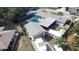 Aerial view of a backyard featuring a private swimming pool and fenced yard at 116 Hampden Rd, Winter Haven, FL 33884