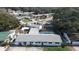 Aerial view of a home featuring a private swimming pool, fenced backyard, and well-maintained landscaping at 116 Hampden Rd, Winter Haven, FL 33884