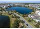 Aerial view showcasing the home near a lake in a lovely planned community at 13432 Beebe Aly, Orlando, FL 32827
