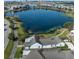 Stunning aerial view of the home, highlighting its proximity to the tranquil lake and surrounding community at 13432 Beebe Aly, Orlando, FL 32827