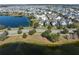 Expansive aerial view showcasing the home's prime location within a vibrant lakeside community at 13432 Beebe Aly, Orlando, FL 32827