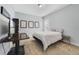 Bedroom featuring carpeted flooring, a television, and a window with blinds at 13432 Beebe Aly, Orlando, FL 32827