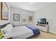 Neutral bedroom showcasing a window with white blinds, a television, and simple decor at 13432 Beebe Aly, Orlando, FL 32827