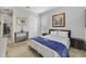Cozy bedroom with a large window, light-colored carpet, and a view into an office at 13432 Beebe Aly, Orlando, FL 32827