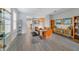 Bright dining room with glass table and chairs, modern cabinet, and charming decor at 13432 Beebe Aly, Orlando, FL 32827