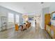 Inviting dining space with stylish glass table, seating, and seamless flow to other rooms at 13432 Beebe Aly, Orlando, FL 32827
