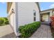 Charming home exterior featuring a brick walkway, well-maintained landscaping, and a cozy front porch at 13432 Beebe Aly, Orlando, FL 32827