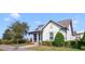 Charming single-story home with a well-manicured lawn and a welcoming front porch under a clear blue sky at 13432 Beebe Aly, Orlando, FL 32827