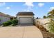 View of the home's garage, driveway, landscaping, and front exterior on a sunny day at 13432 Beebe Aly, Orlando, FL 32827