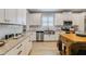 Modern kitchen with granite countertops, stainless steel appliances, and a functional island at 13432 Beebe Aly, Orlando, FL 32827