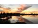 Scenic sunset lake view reflecting vibrant colors, creating a serene and picturesque landscape at 13432 Beebe Aly, Orlando, FL 32827