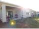 This home features a covered patio with a grill overlooking a spacious backyard at 1360 Berry Ln, Davenport, FL 33837
