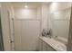 Bathroom features a double sink vanity with a shower and bathtub at 1360 Berry Ln, Davenport, FL 33837