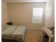 Comfortable bedroom features a bed, window, and carpeted floors at 1360 Berry Ln, Davenport, FL 33837