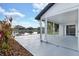 Relax on the back porch with a view of the lake in the backyard at 1410 Rena Ln, Kissimmee, FL 34744