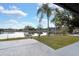 The backyard has a view of the lake and the large backyard at 1410 Rena Ln, Kissimmee, FL 34744