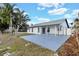 The outdoor space features a covered patio, and an expansive yard, enhancing outdoor living at 1410 Rena Ln, Kissimmee, FL 34744
