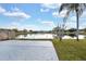 An open concrete patio extends the entertaining space of the well-maintained backyard at 1410 Rena Ln, Kissimmee, FL 34744