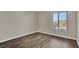 This bedroom has wood flooring and a window at 1410 Rena Ln, Kissimmee, FL 34744