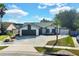 Well-manicured lawn and landscaping enhances the curb appeal of this charming home at 1410 Rena Ln, Kissimmee, FL 34744