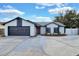 Beautiful one-story home with a two car garage and a well manicured front yard at 1410 Rena Ln, Kissimmee, FL 34744