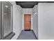 Inviting front porch with a brown door and a black matte at 1410 Rena Ln, Kissimmee, FL 34744