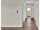 Hallway featuring wood flooring that leads to the bathroom at 1410 Rena Ln, Kissimmee, FL 34744