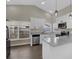 Updated kitchen with modern appliances, white cabinets and an extended breakfast bar at 1410 Rena Ln, Kissimmee, FL 34744