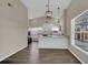 Open-concept dining area with views of the beautifully updated kitchen and breakfast bar at 1410 Rena Ln, Kissimmee, FL 34744