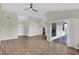 Living room with great natural light, new flooring, ceiling fan and entry to bedrooms at 1410 Rena Ln, Kissimmee, FL 34744