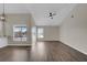 Spacious living room with new flooring and a ceiling fan at 1410 Rena Ln, Kissimmee, FL 34744