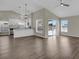 Open-concept living space with views of the dining area and sliding glass door to the backyard at 1410 Rena Ln, Kissimmee, FL 34744