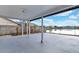 The covered patio offers an outdoor living space overlooking the lake at 1410 Rena Ln, Kissimmee, FL 34744