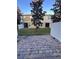 Private backyard offers a paver patio and well-maintained lawn enclosed by a white fence at 14257 Desert Haven St # Ge, Windermere, FL 34786