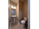 Cozy half-bathroom includes a pedestal sink and modern toilet at 14257 Desert Haven St # Ge, Windermere, FL 34786