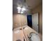 Bathroom featuring double sinks, framed mirror and a view into the bedroom at 14257 Desert Haven St # Ge, Windermere, FL 34786
