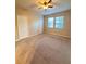 Spacious bedroom with carpeting, two closets, ceiling fan and double windows for natural light at 14257 Desert Haven St # Ge, Windermere, FL 34786