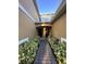 A welcoming entryway with neatly landscaped shrubs leads to dual front doors at 14257 Desert Haven St # Ge, Windermere, FL 34786