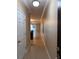 Bright hallway featuring tile flooring that flows into an open-concept living area at 14257 Desert Haven St # Ge, Windermere, FL 34786