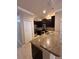 Stylish kitchen features granite countertops, stainless steel appliances, and ample cabinet space at 14257 Desert Haven St # Ge, Windermere, FL 34786
