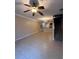Open-concept living space boasting ceramic tile flooring with a staircase and elegant chandelier at 14257 Desert Haven St # Ge, Windermere, FL 34786