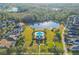 Aerial view of a beautiful community with a pool and community center near a body of water at 14637 Tanja King Blvd, Orlando, FL 32828